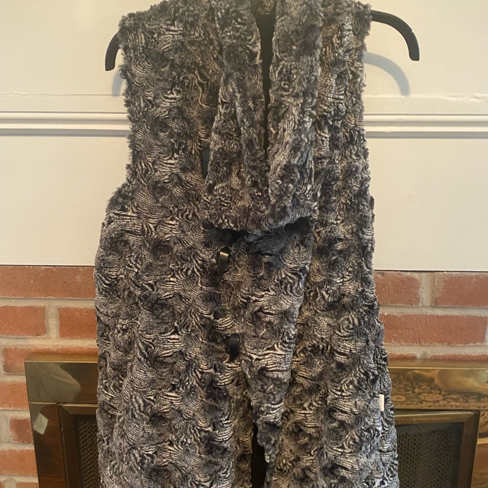 Mid length furry vest.